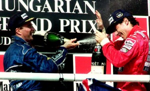 Mansell sprays Senna with champagne